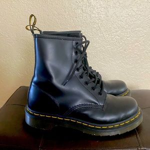 Dr.Martens leather black combat boots. In size 7, boots do fit small.